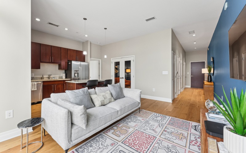 living room with large hallway and open kitchen